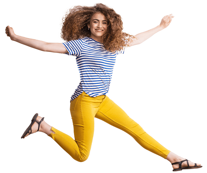 Woman in bright yellow pants leaping